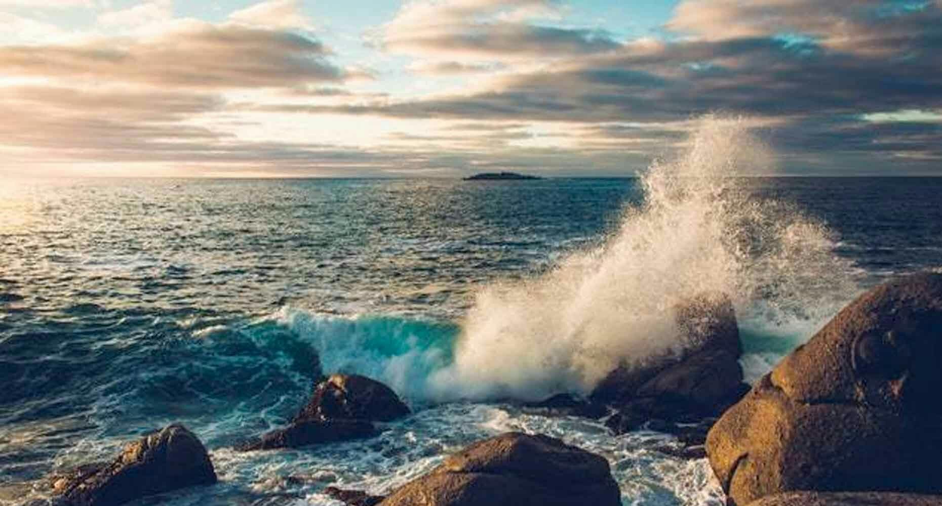 waves crashing on a rock