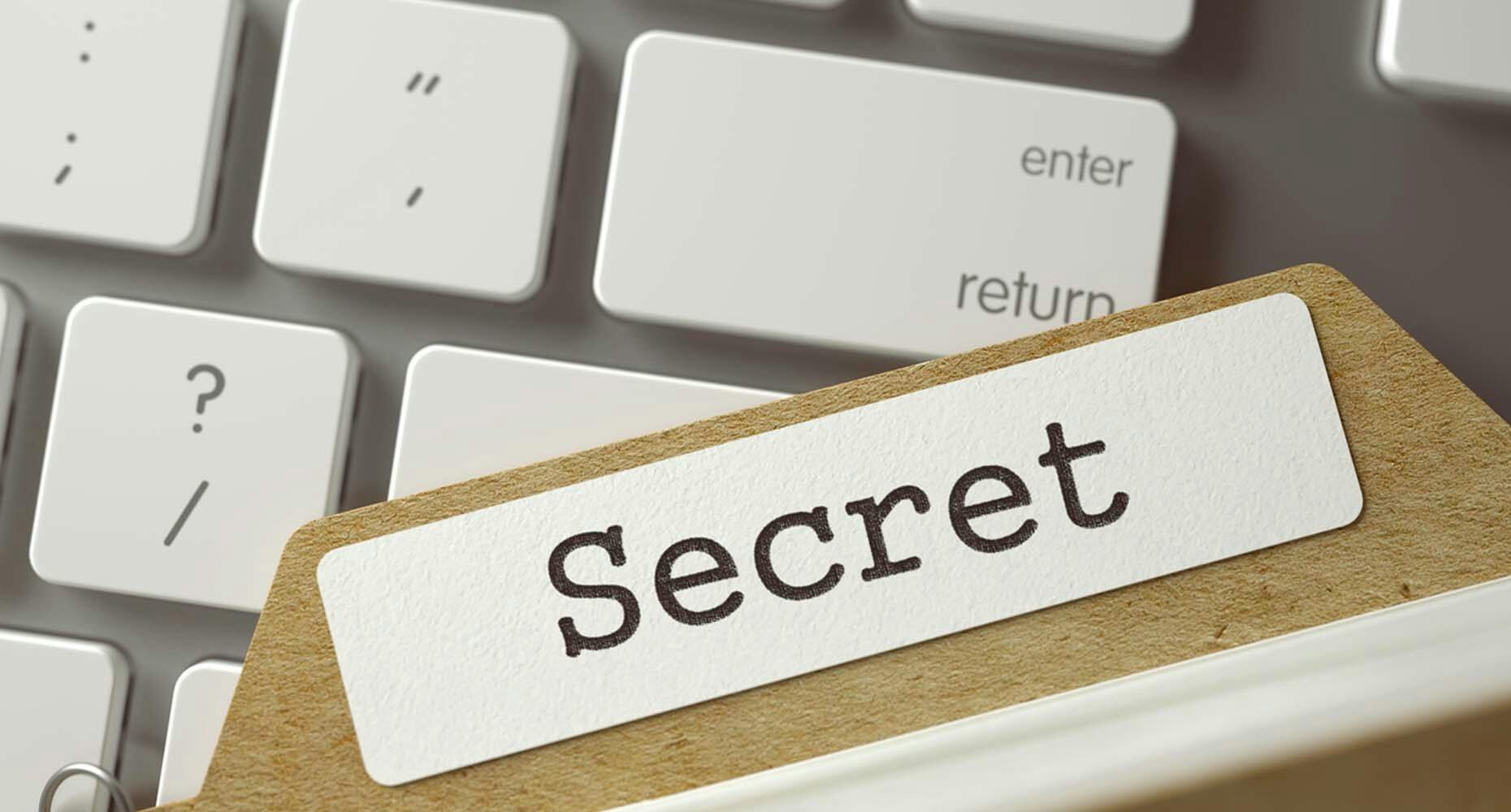 A file with the word "secret" to represent Manny Medina, CEO of Outreach, under cover as an employee