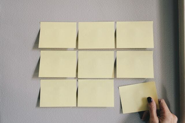 blank post it notes on a wall
