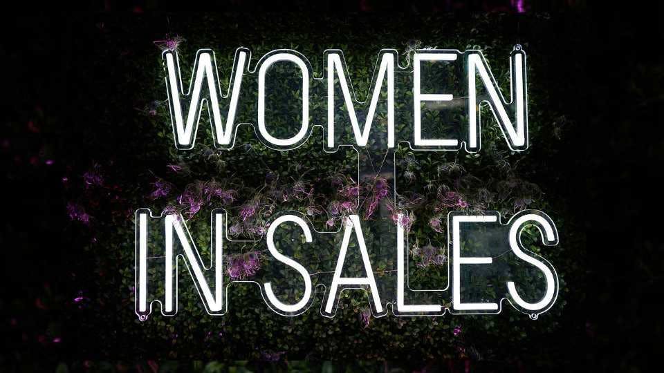 women in sales light up sign